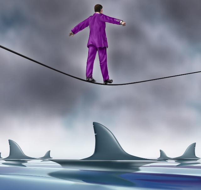 Man on rope above sharks